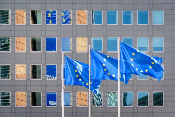 european-flags-blowing-in-the-wind-in-front-of-the-european-in-picture-id1145037454