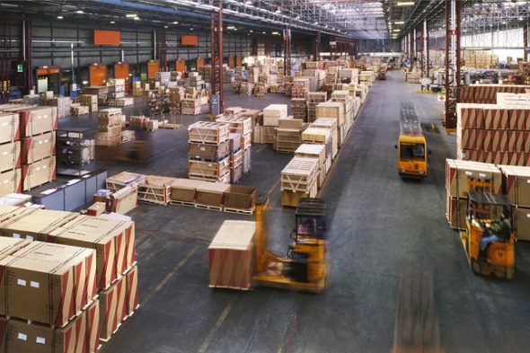 view-from-above-inside-a-busy-huge-industrial-warehouse-picture-id157558600